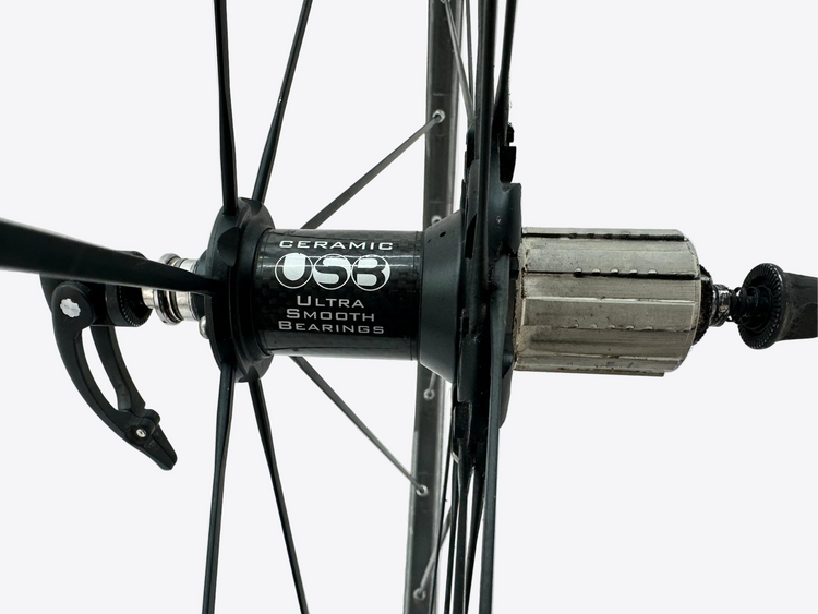 Close-up of a bicycle hub with 'USB' branding on a white background