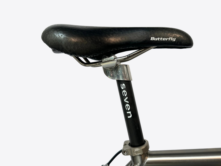Bicycle seat with 'Butterfly' branding on a light gray background