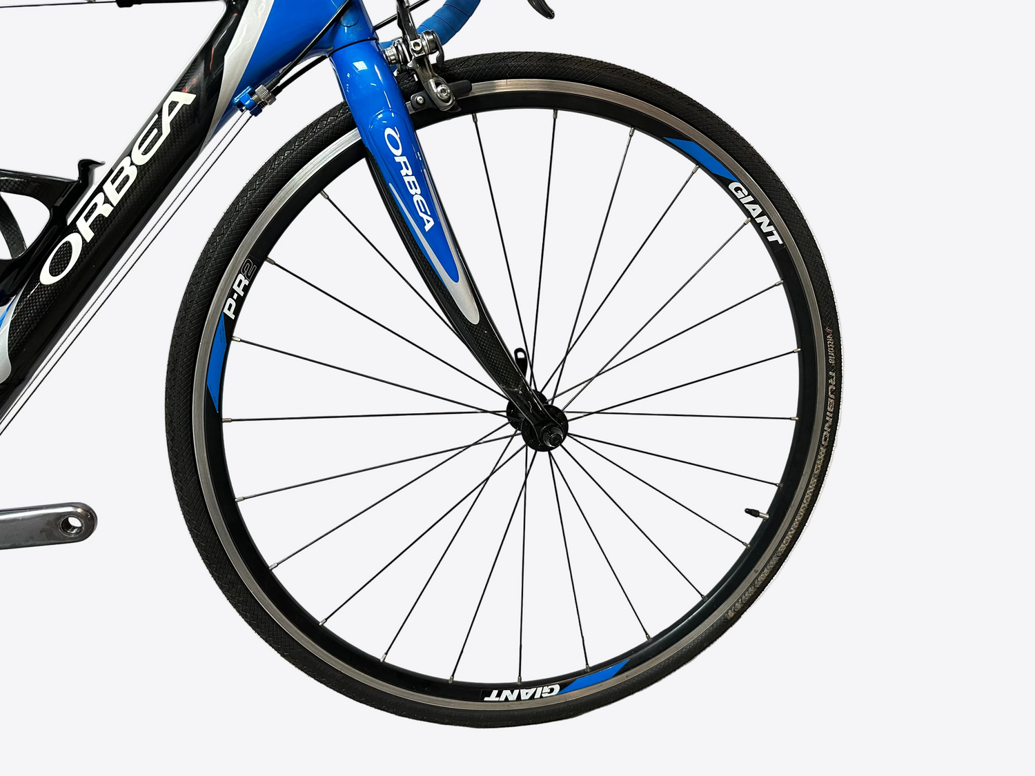 Close-up of a bicycle wheel with 'Orbea' and 'Giant' branding on a white background