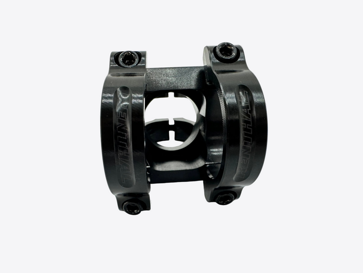 Black mechanical component on a white background