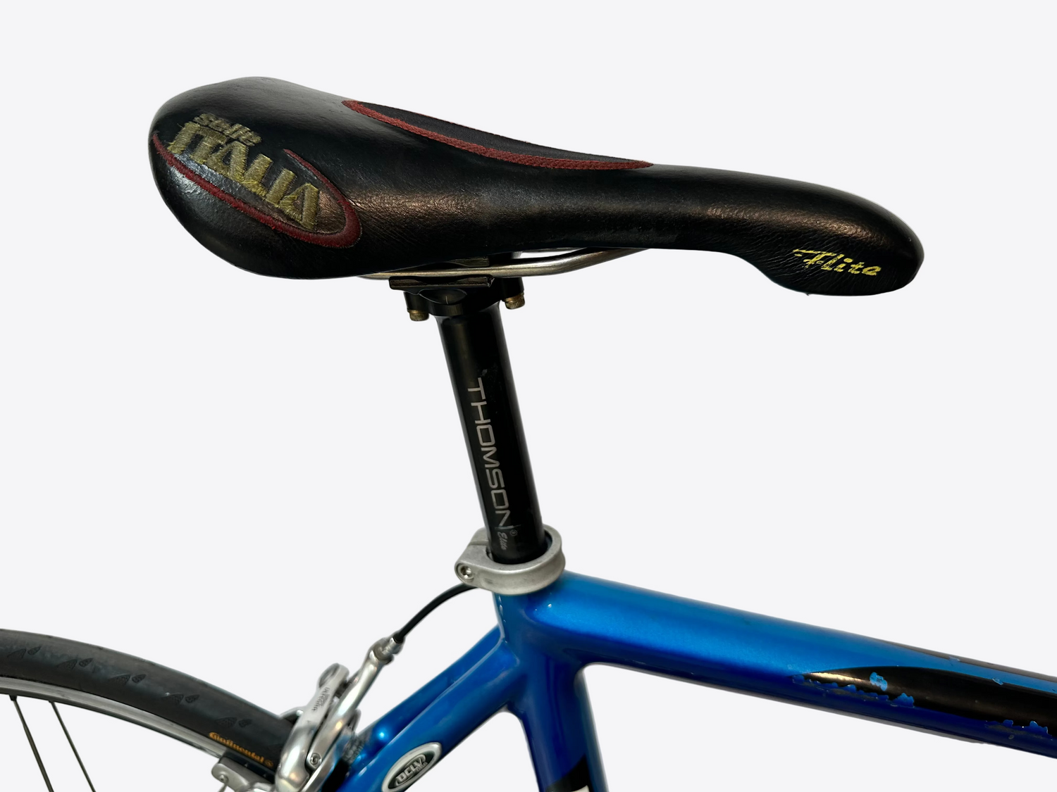 Close-up of a bicycle seat with 'Fizik' branding on a white background