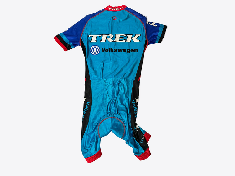Blue racing suit with Trek and Volkswagen logos on a white background