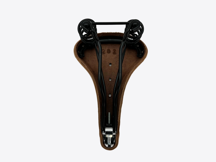Brown bicycle seat with black metal components on a white background