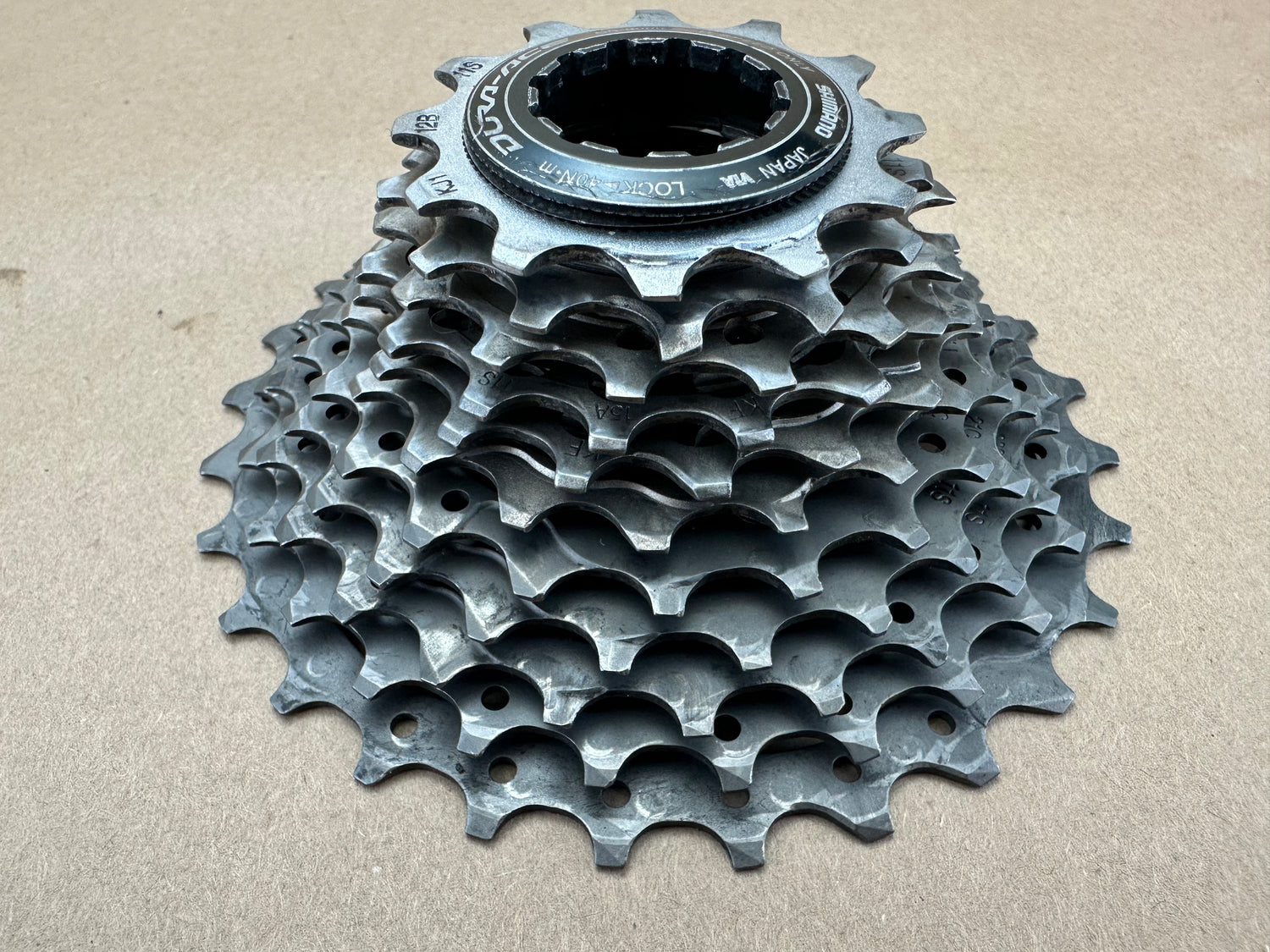 Bicycle gear cassette on a beige background