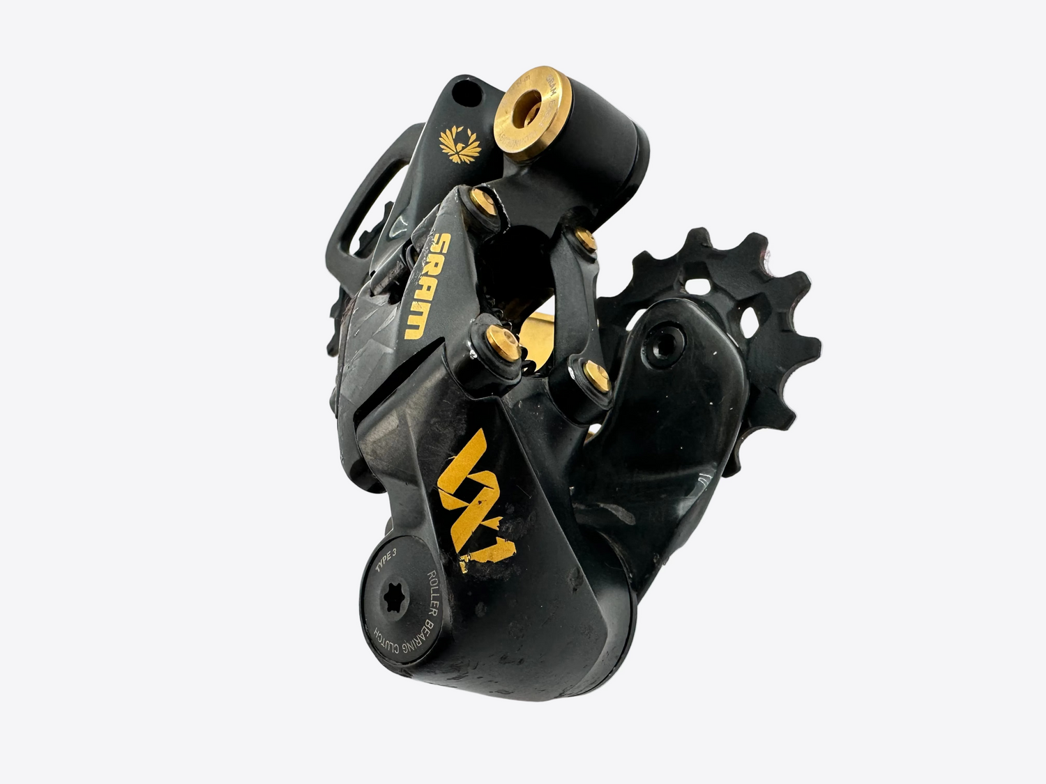 Black and gold bicycle gear mechanism on a white background