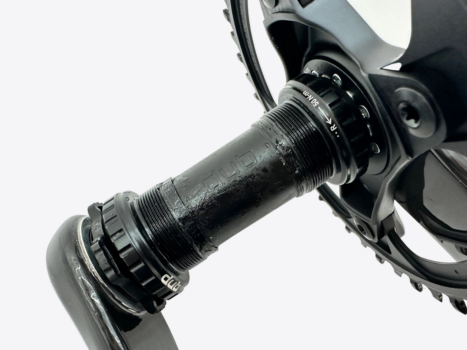Close-up of a bicycle crankset on a white background