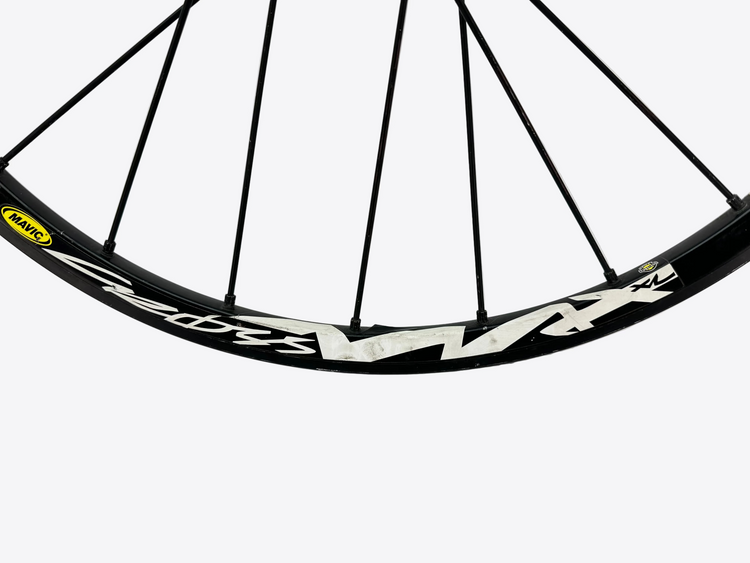 Bicycle wheel with black rim and white text on a white background