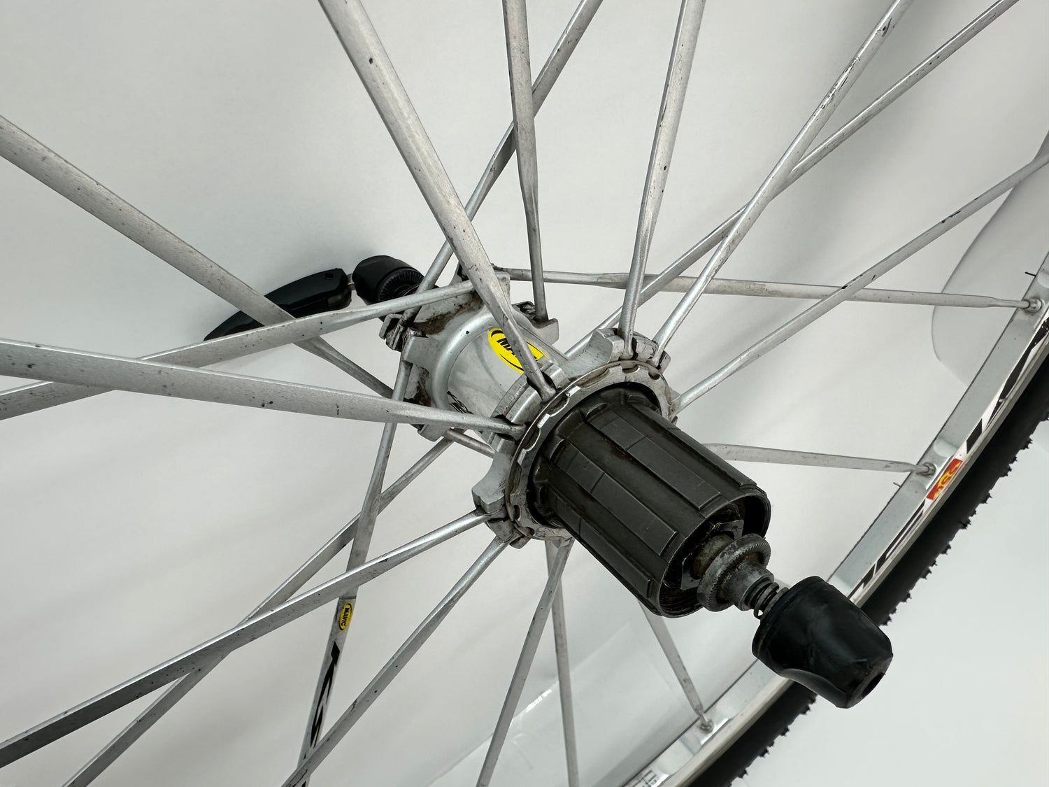 Close-up of a bicycle wheel hub on a white background
