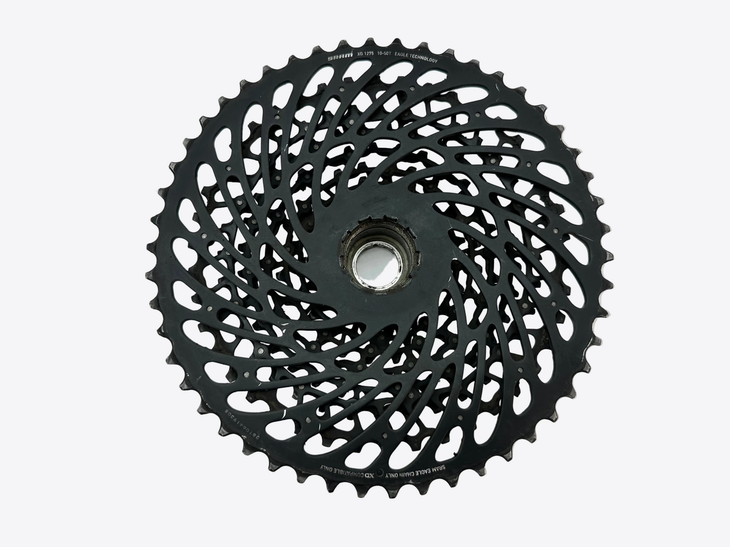 Black bicycle gear cassette on a white background