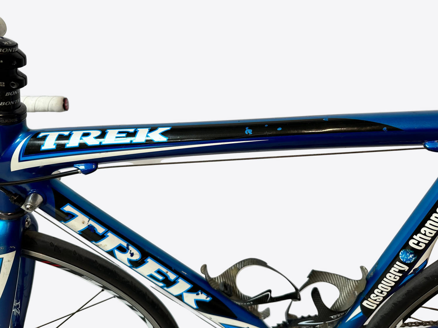 Close-up of a blue Trek bicycle frame with a white background