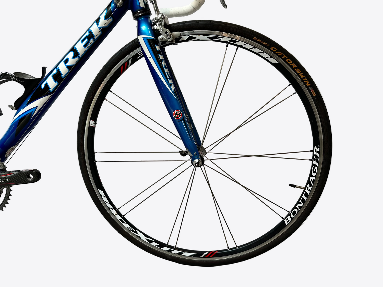 Blue bicycle wheel with 'Trek' branding on a white background