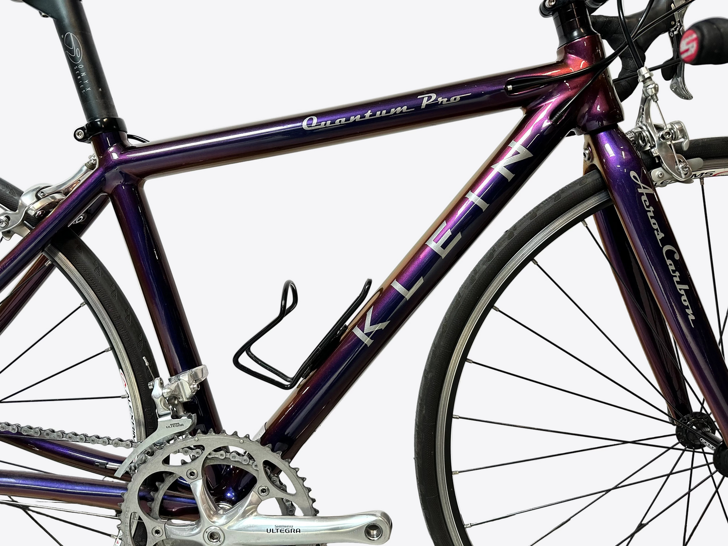 Purple bicycle with 'Quantum Pro' branding on a white background