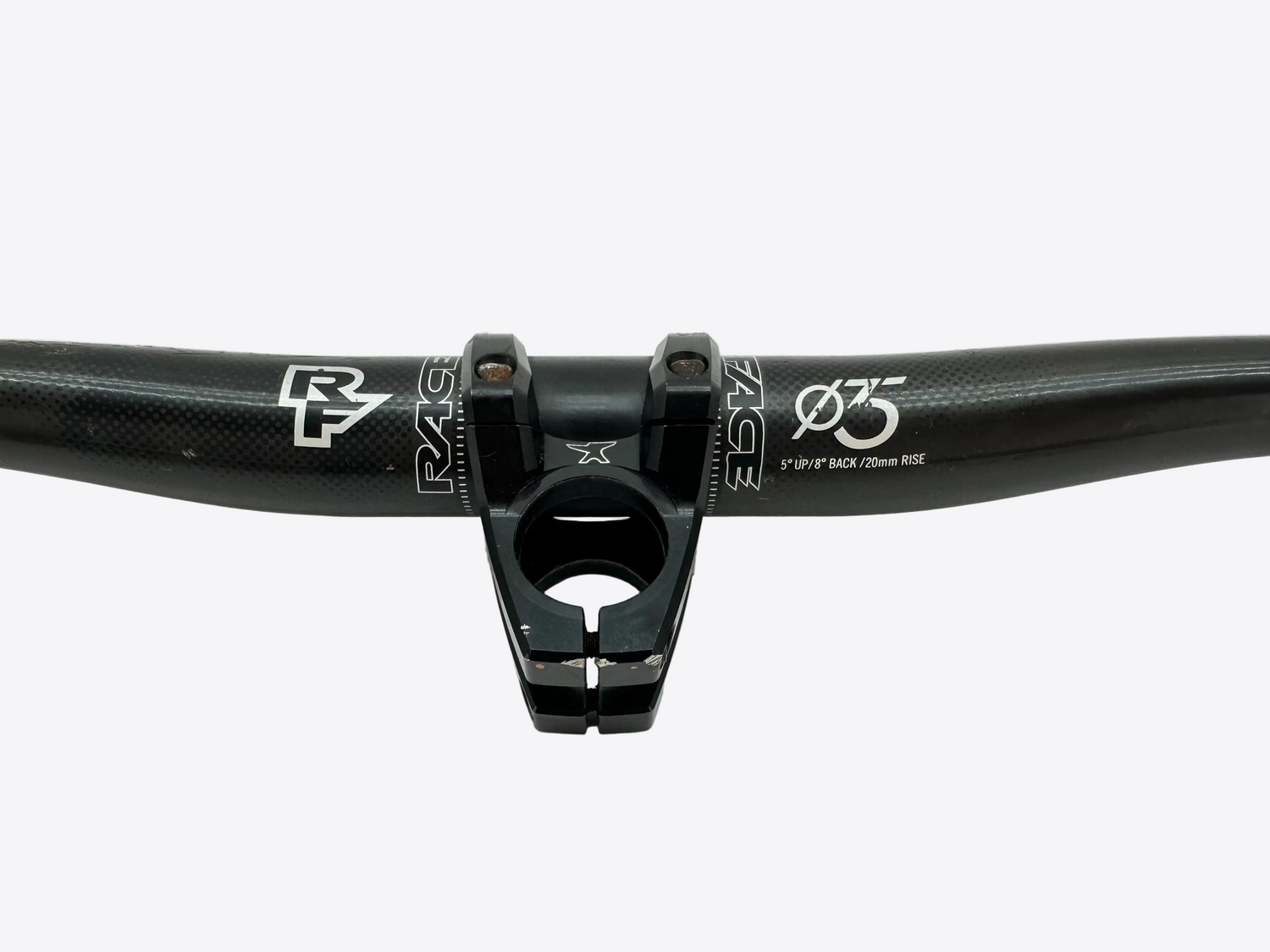 Black bicycle handlebar with visible branding on a white background