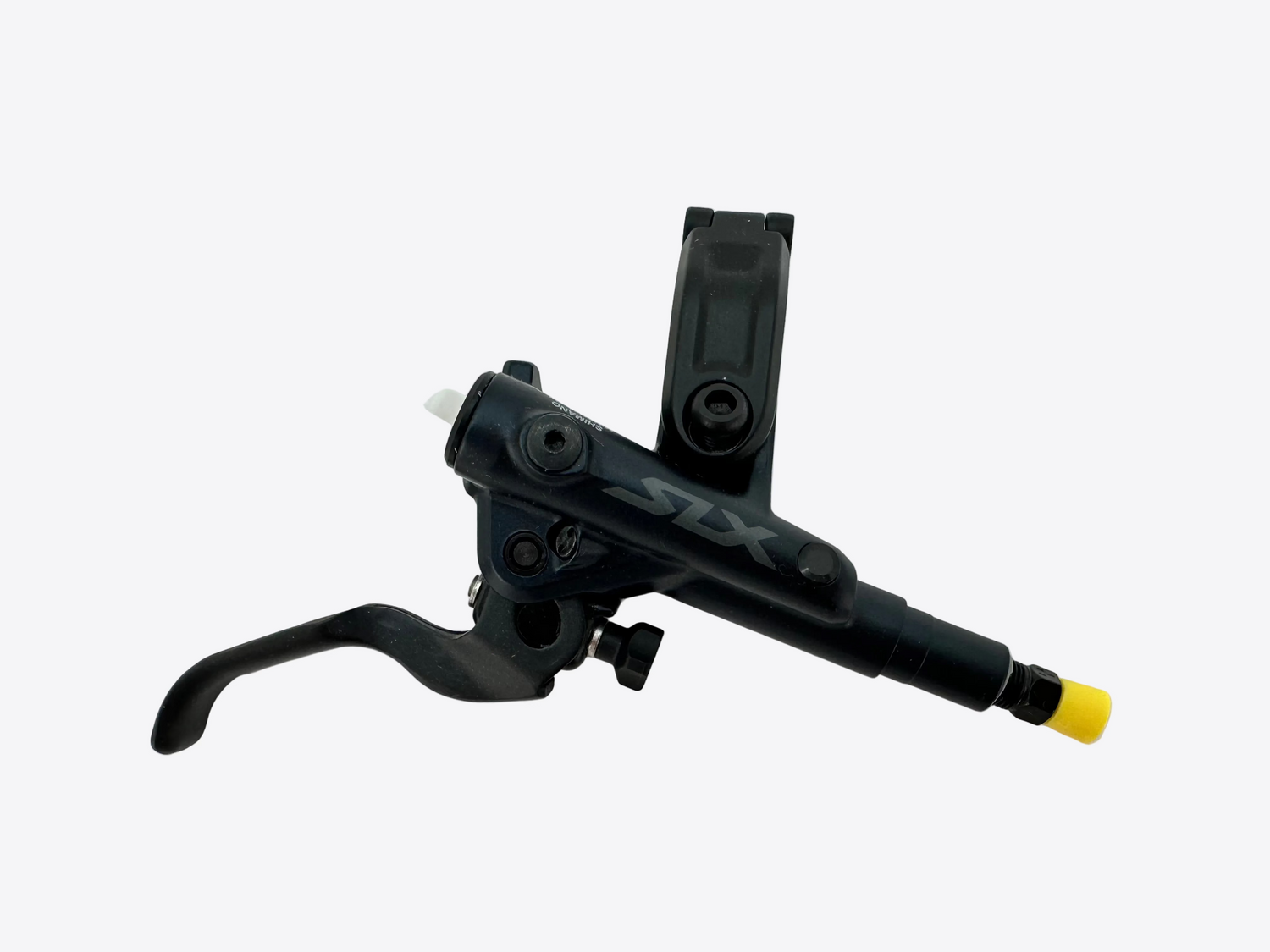 Black brake lever with yellow tip on a white background