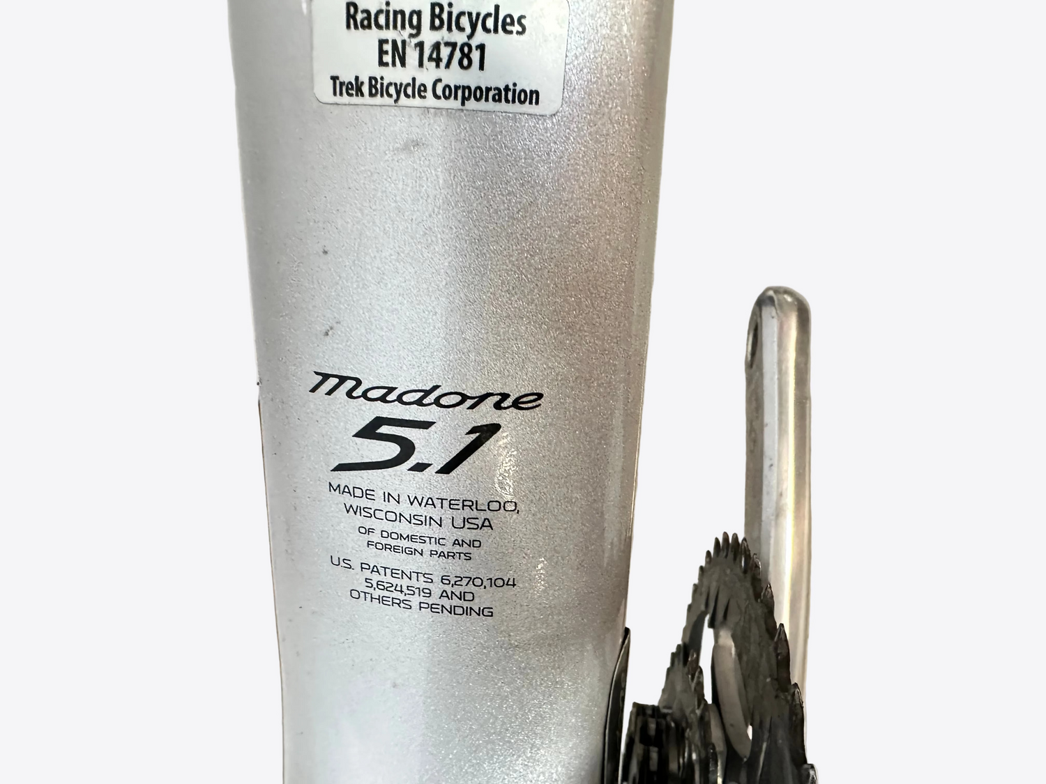 Close-up of a bicycle frame with 'Madone 5.1' branding and Trek Bicycle Corporation label.