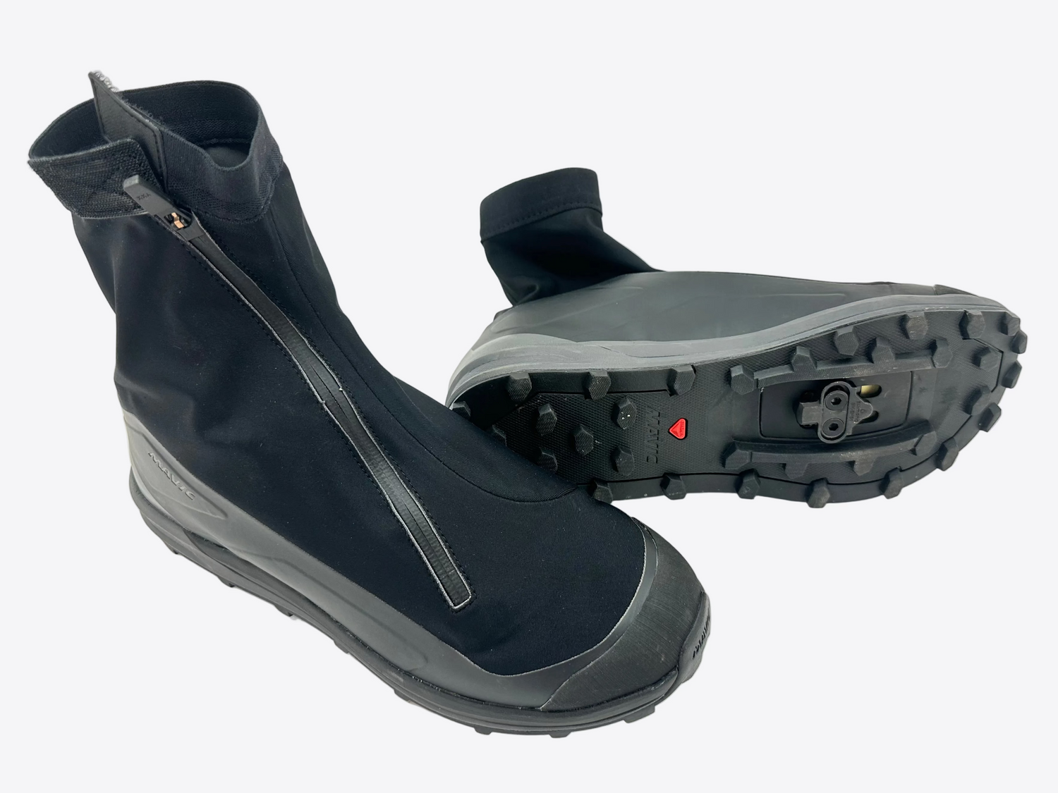 Pair of black bike shoes with zippers on a white background