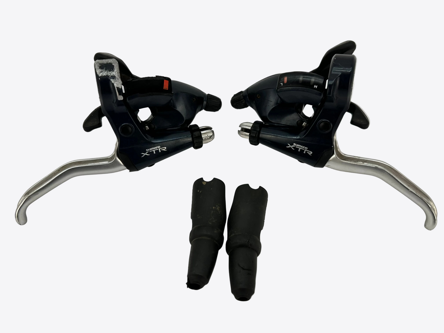 Pair of bicycle shifters with XTR branding on a white background