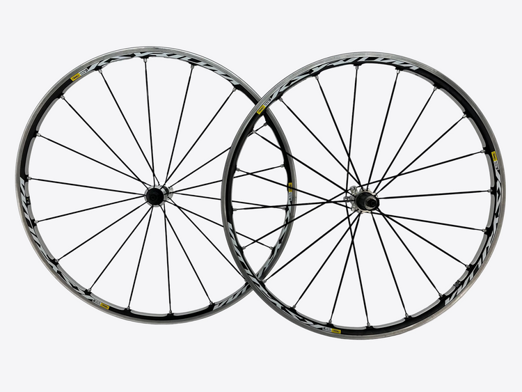 Two bicycle wheels with black spokes on a white background