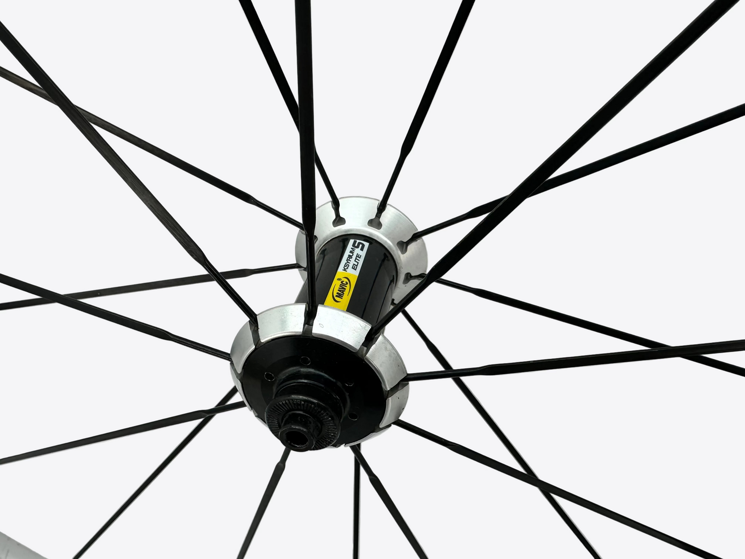 Close-up of a bicycle wheel with a white background