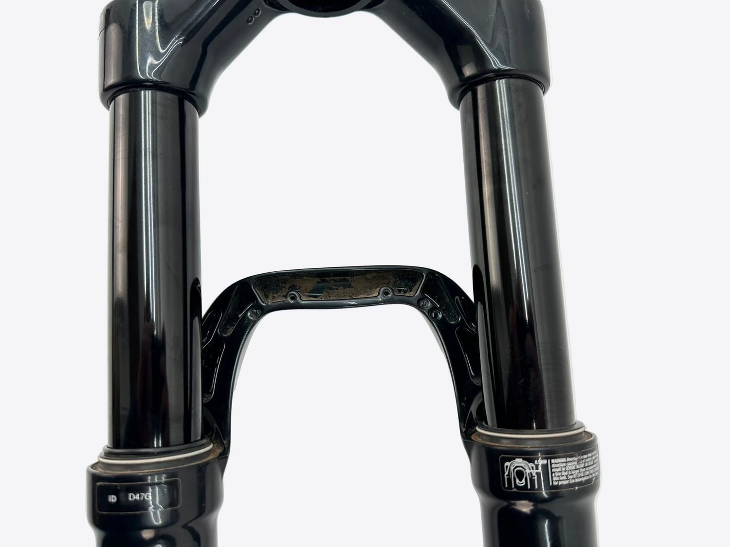 Close-up of a black bicycle fork on a white background