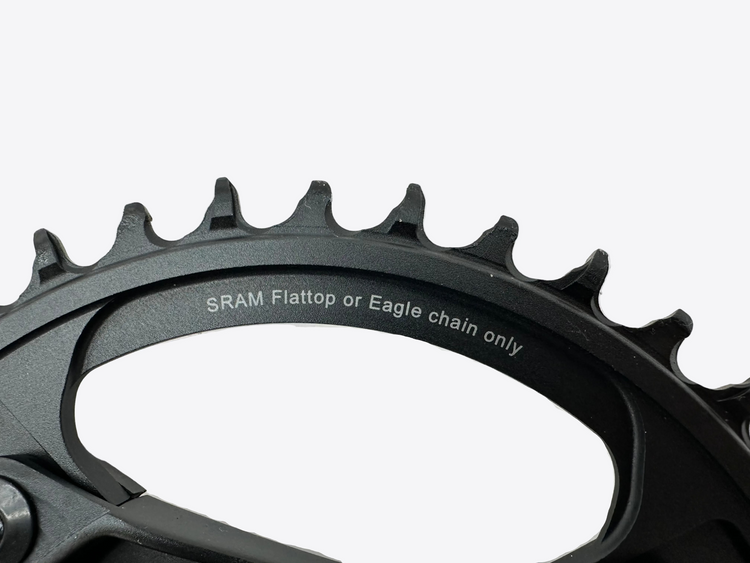 Close-up of a bicycle chainring with SRAM branding on a white background