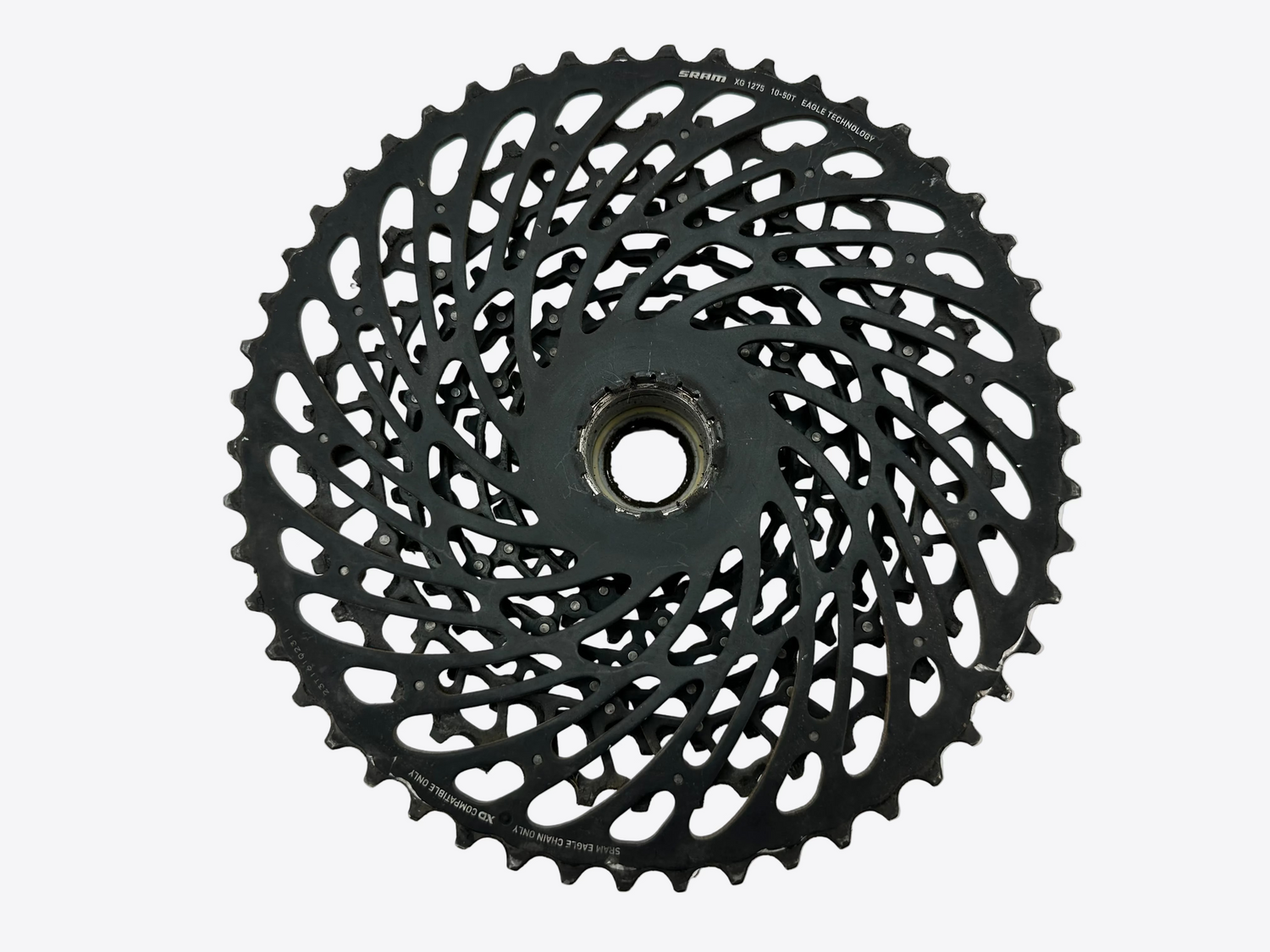 Black bicycle gear cassette on a white background