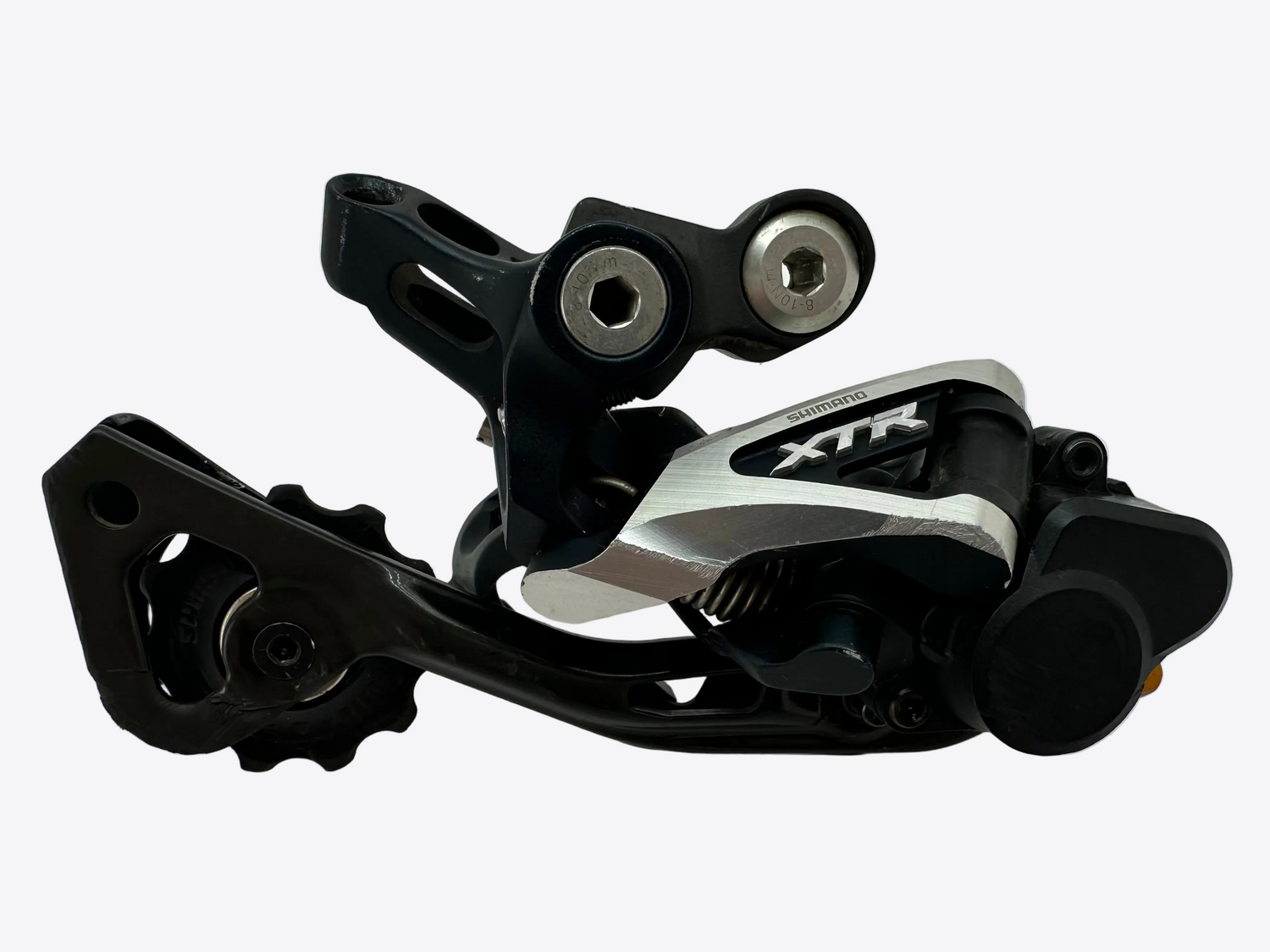 Bicycle derailleur with 'XTR' branding on a white background