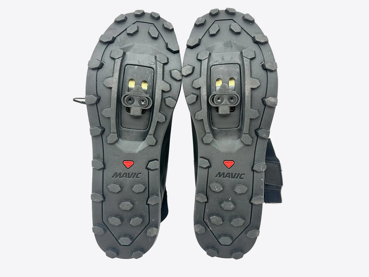 Pair of Mavic cycling shoes with tread pattern on a white background