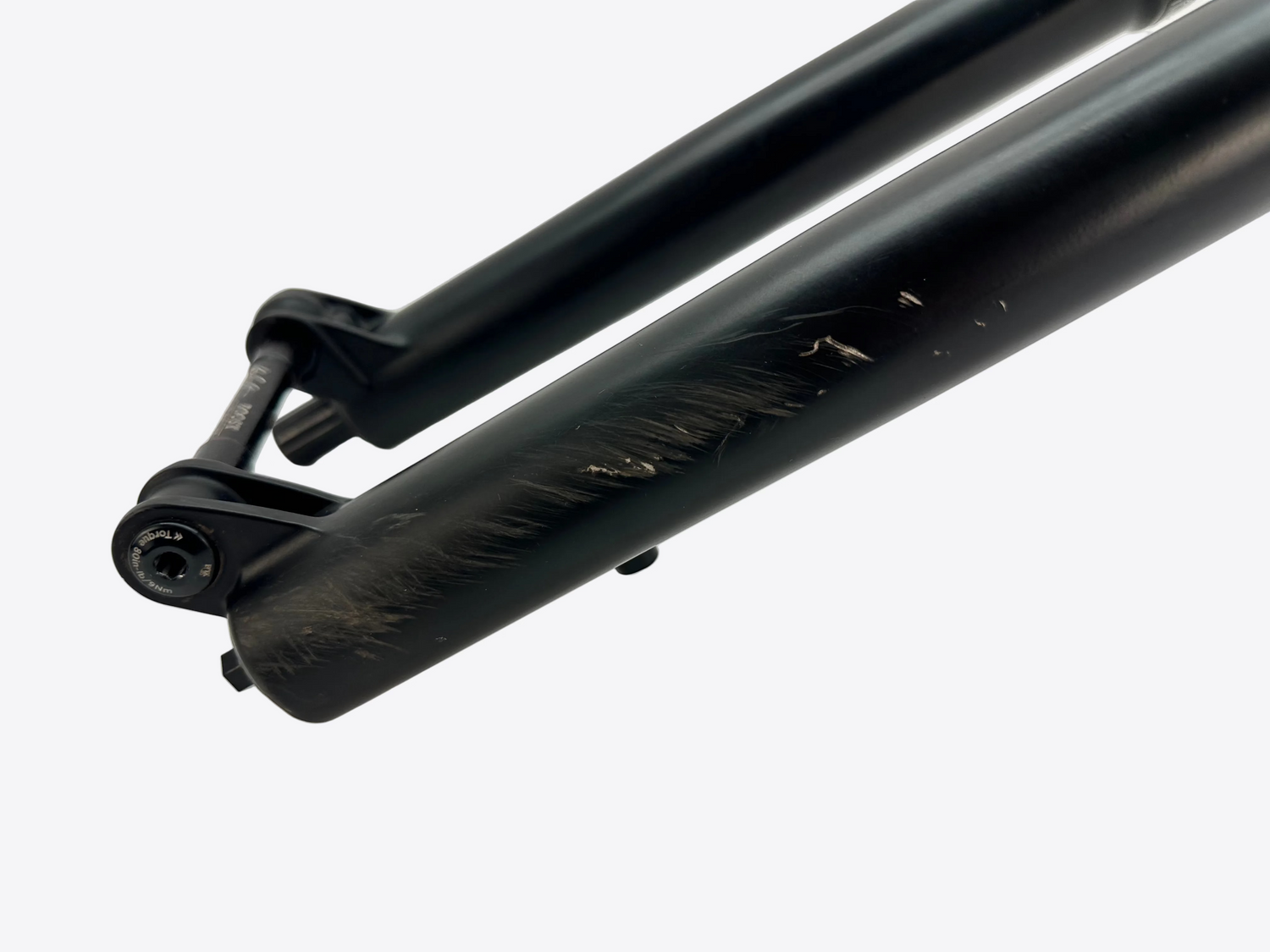 Close-up of a black bicycle fork on a white background