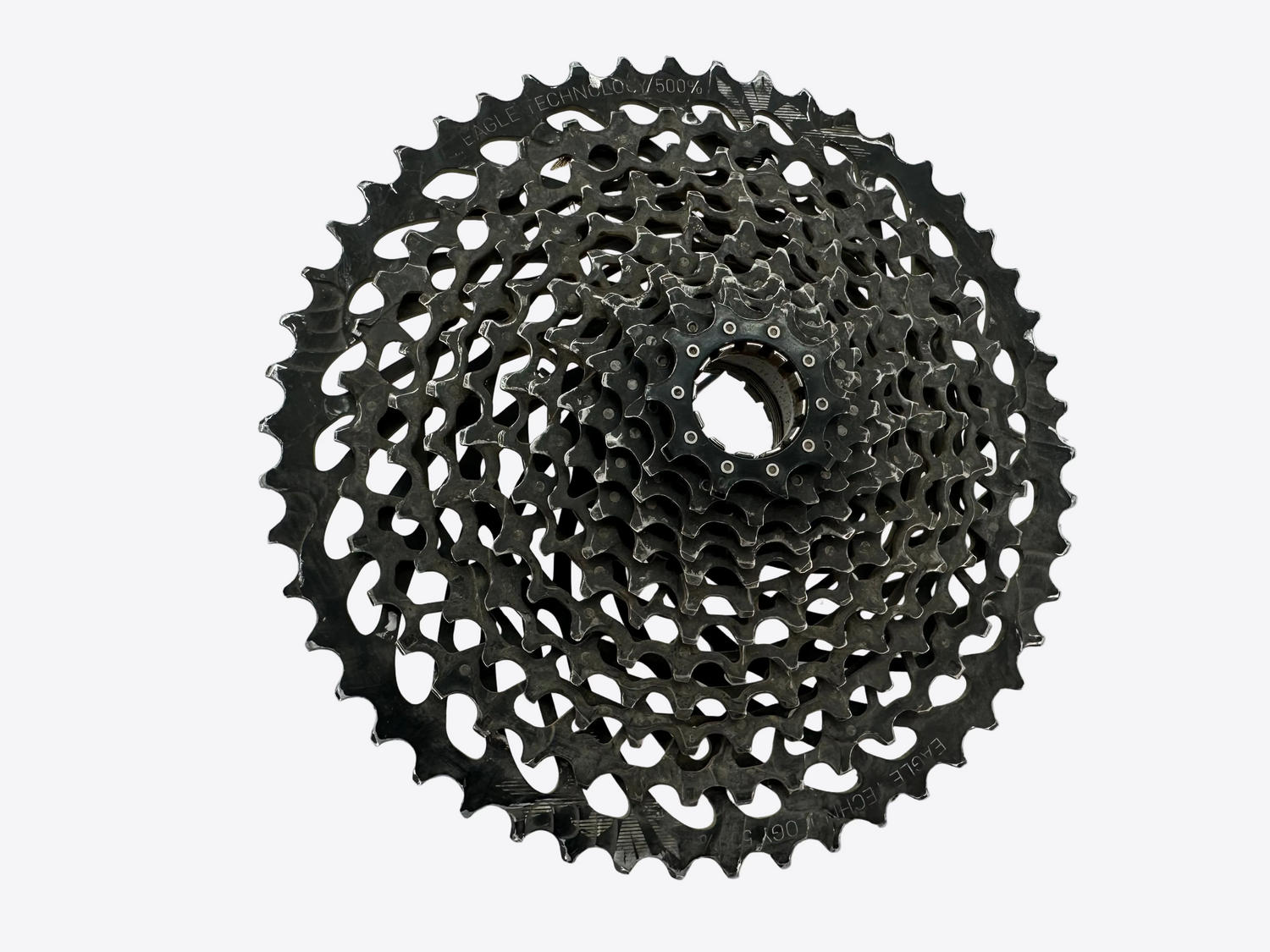 Black bicycle gear cassette on a white background