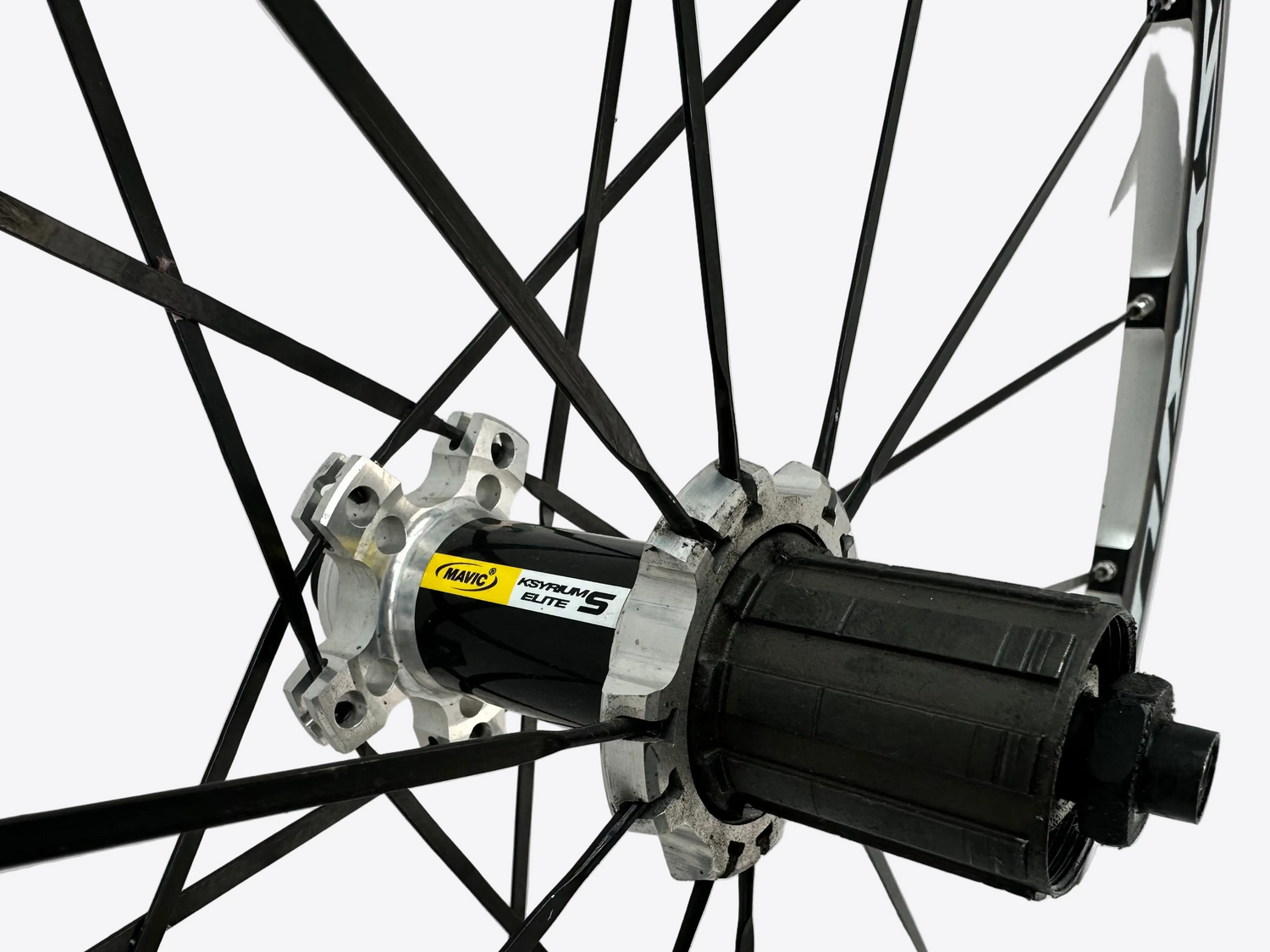 Close-up of a bicycle hub with visible brand logo on a white background