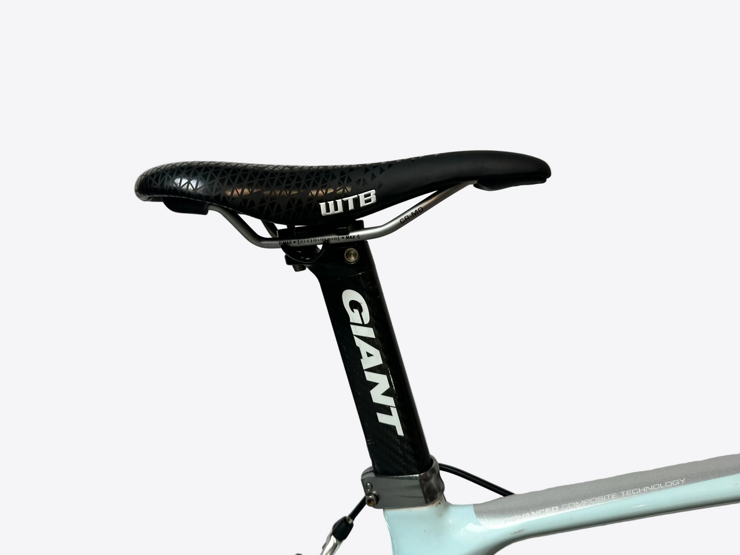 Bicycle seat with WTB saddle and Giant seatpost on a light gray background