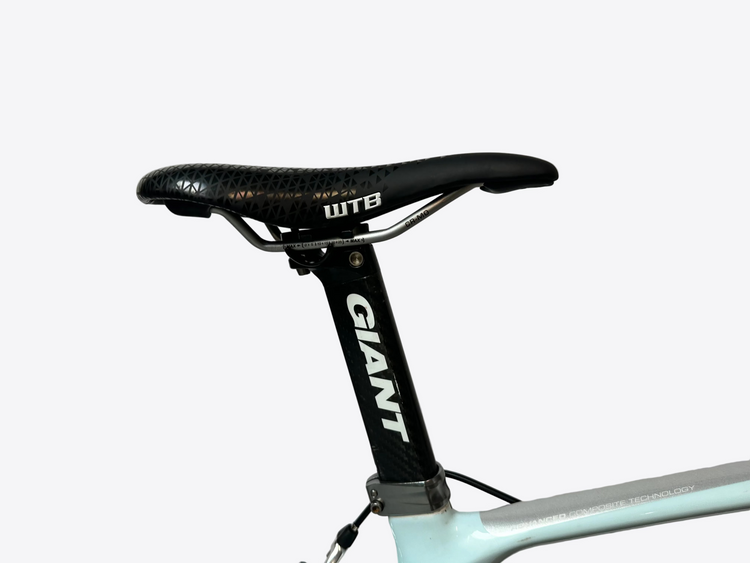 Bicycle seat with WTB saddle and Giant seatpost on a light gray background