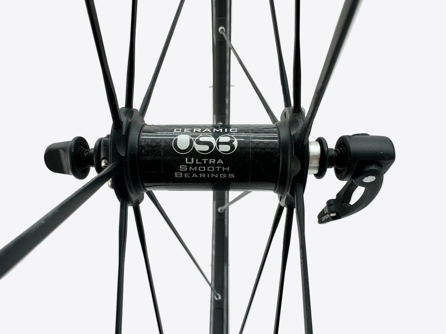Close-up of a bicycle wheel with CeramicSpeed hub on a white background