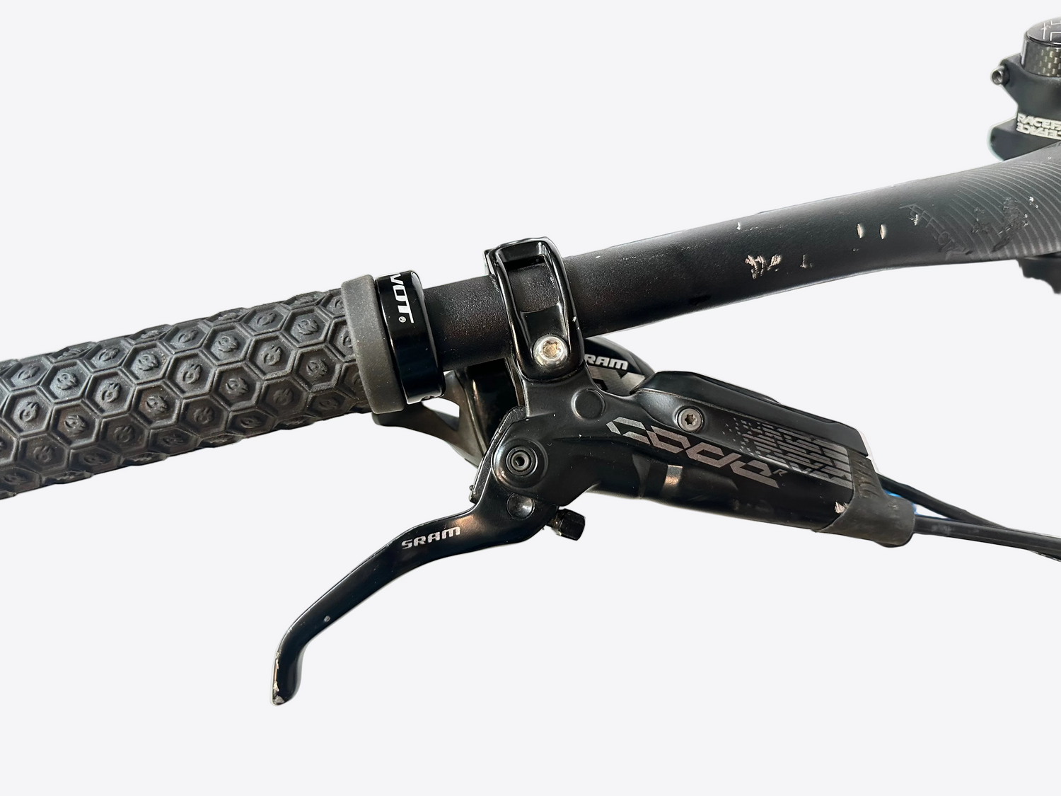 Close-up of a bicycle handlebar with brake lever and 'SRAM' branding.