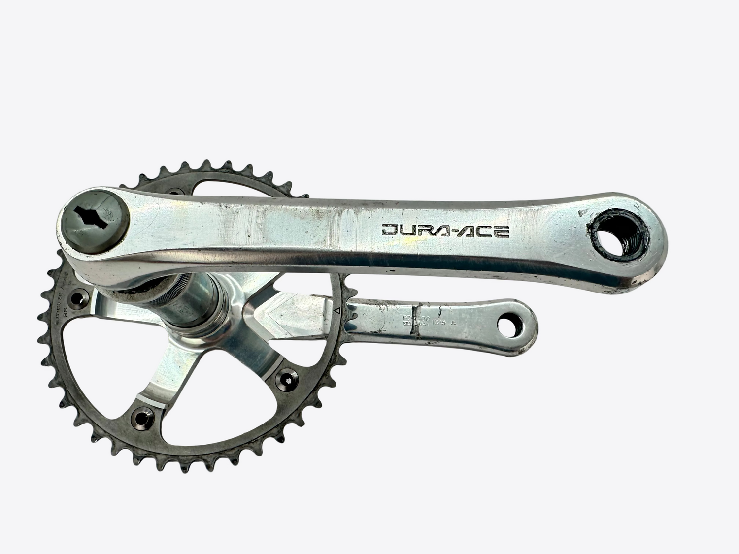 Bicycle crankset with Dura-Ace branding on a white background