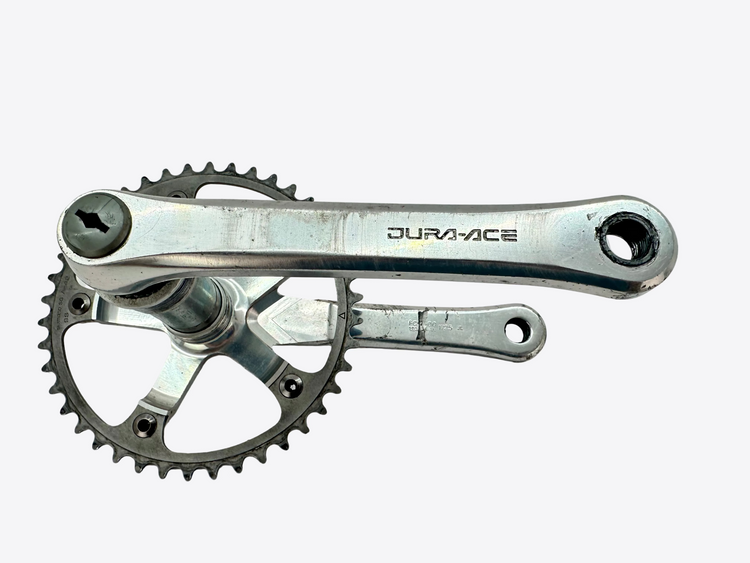 Bicycle crankset with Dura-Ace branding on a white background