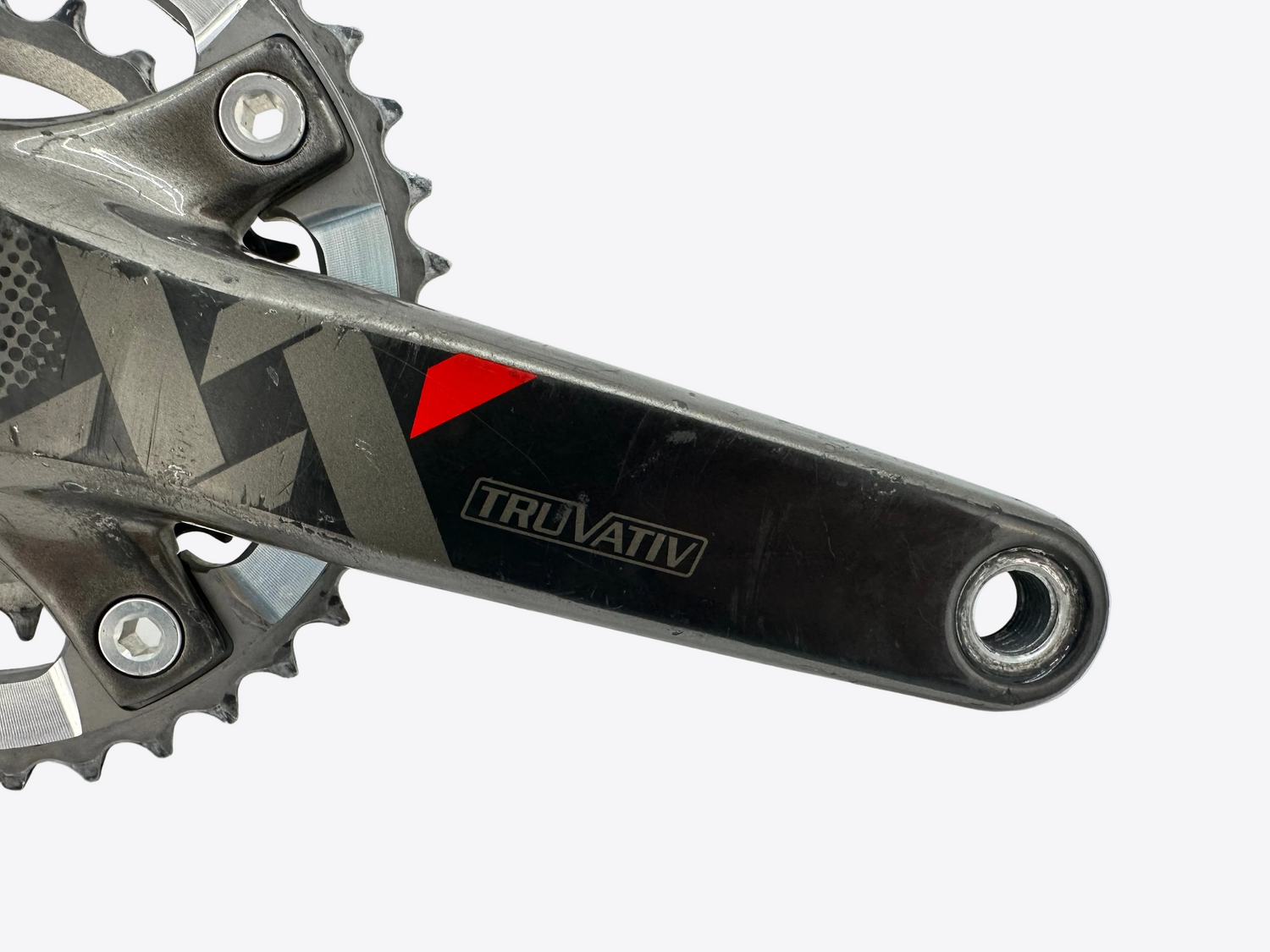 Close-up of a bicycle crankset with 'Truvativ' branding on a white background