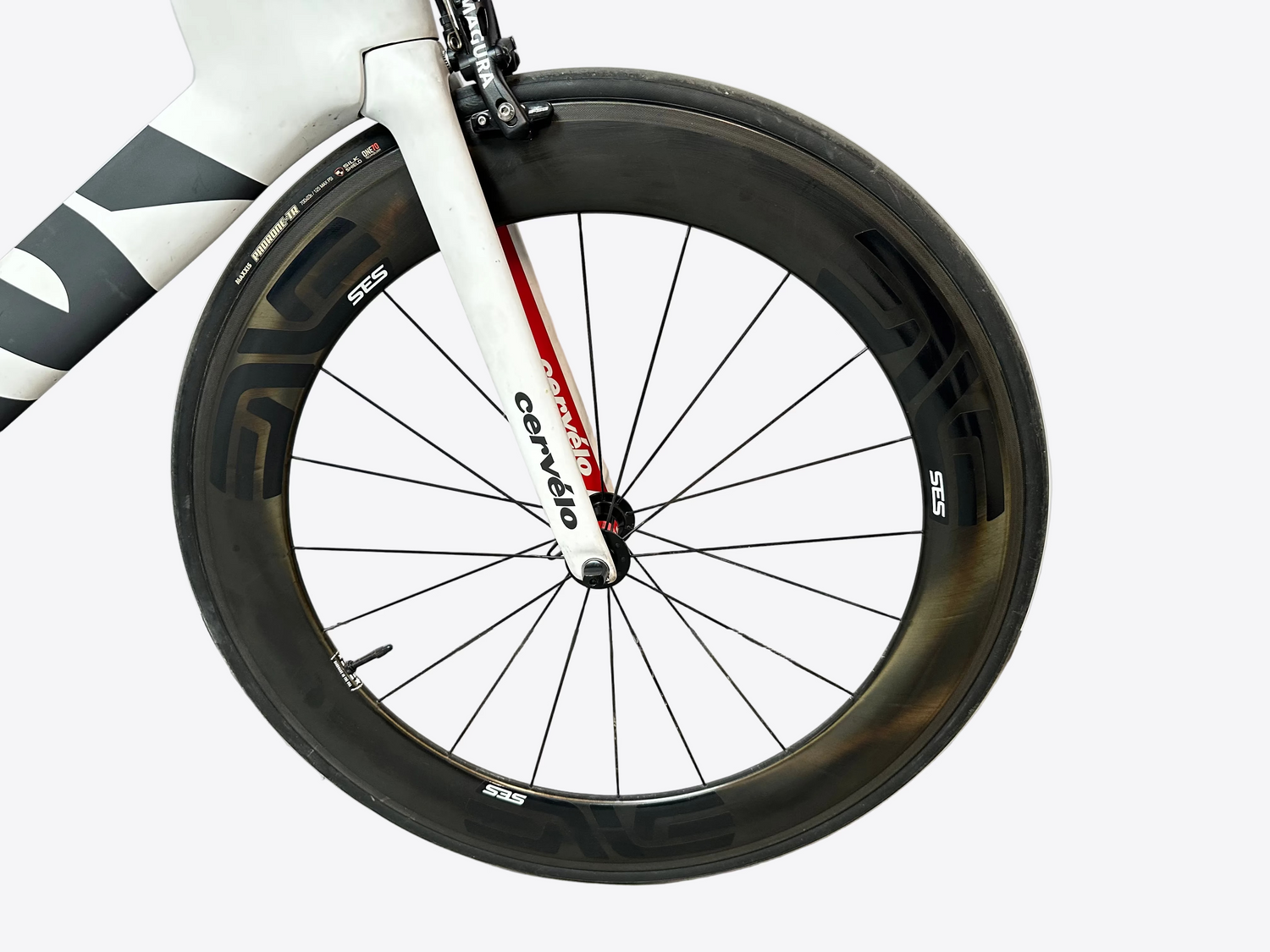 Close-up of a bicycle wheel with 'Cervelo' branding on a white background