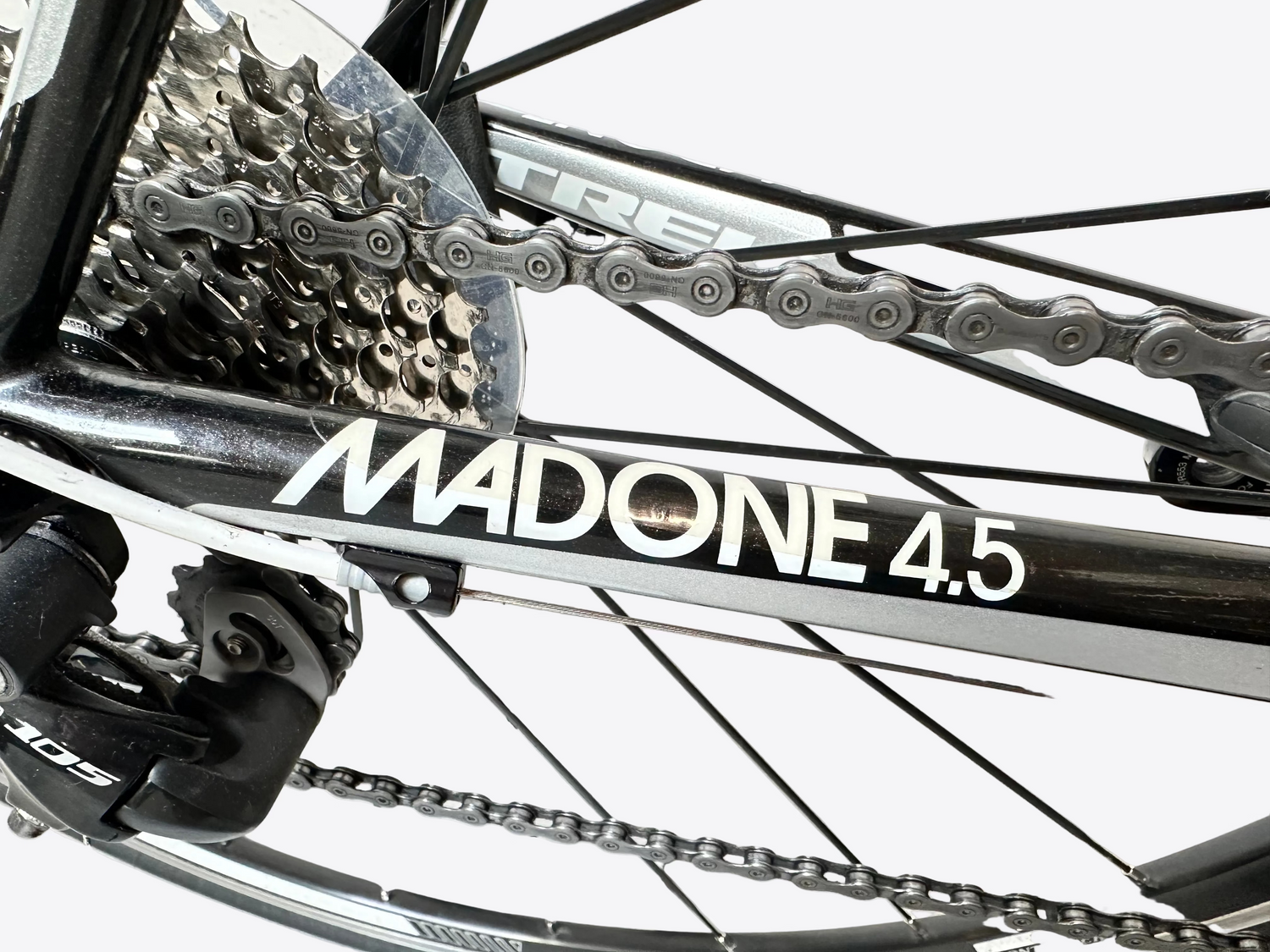 Close-up of a bicycle chain and gear system with 'MADONE 4.5' branding.