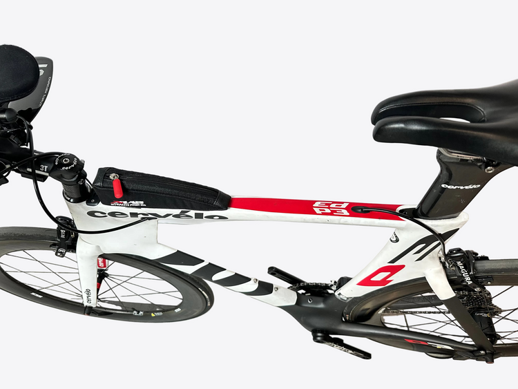 Cervelo P3 bicycle on a concrete floor with a white wall background
