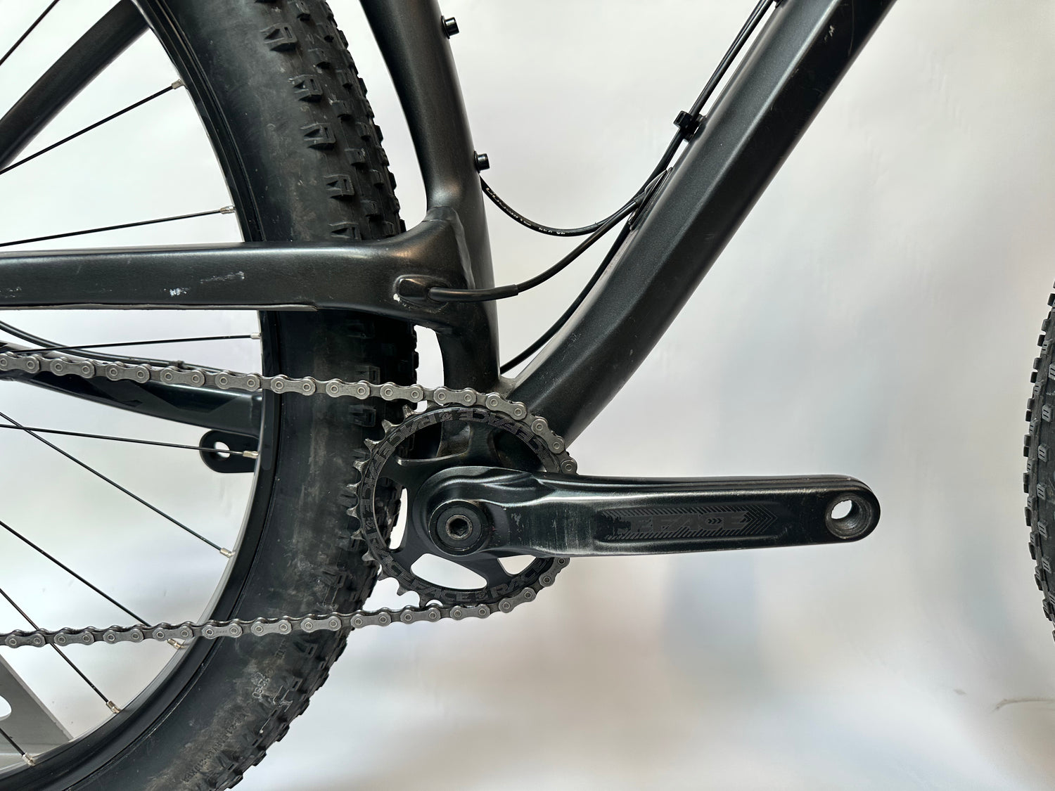 Close-up of a bicycle chain and gear system on a blurred background