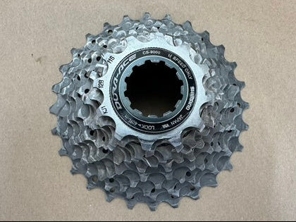 Bicycle gear cassette on a beige background