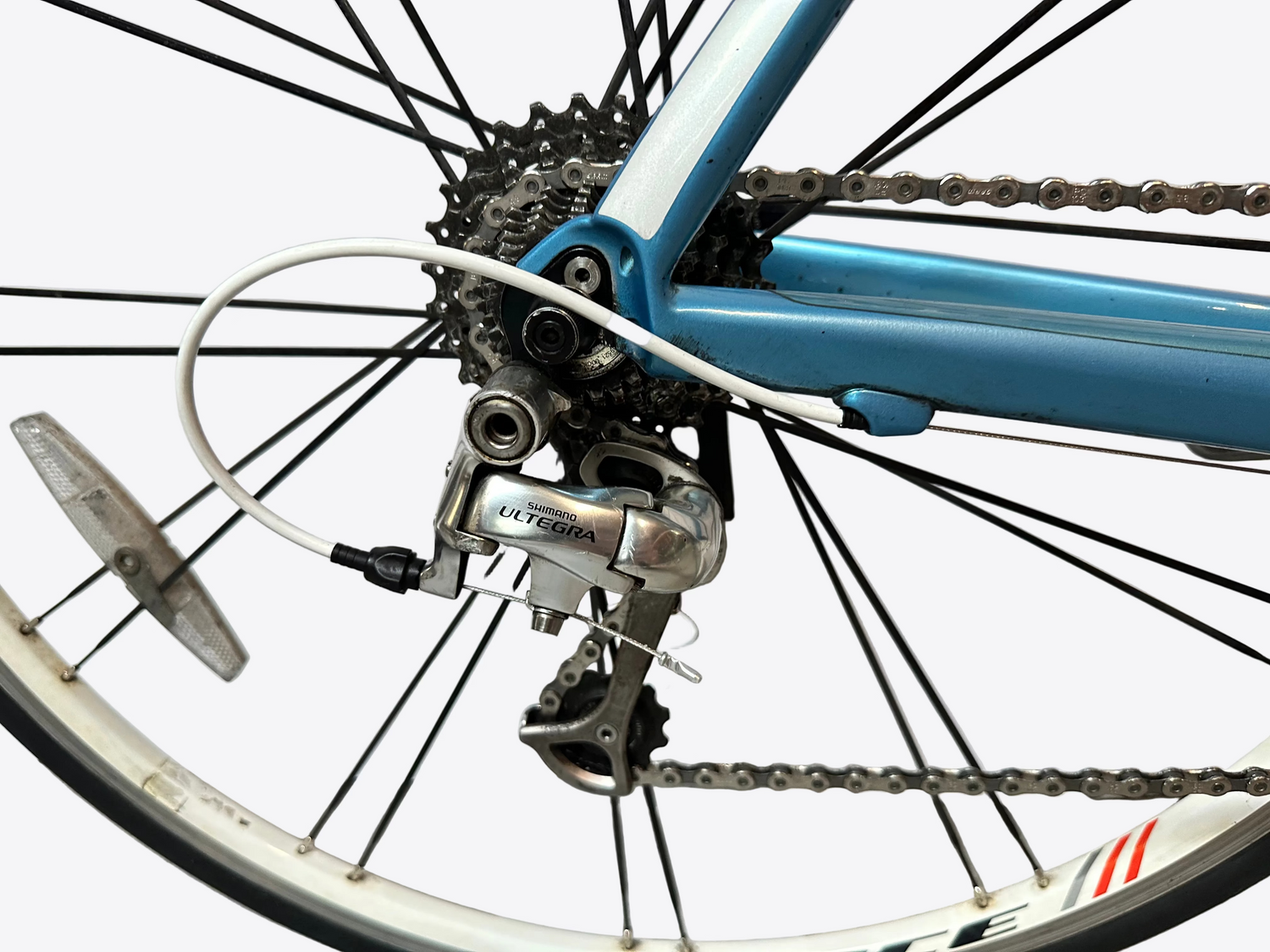 Close-up of a bicycle's rear wheel and gear system with a blurred background