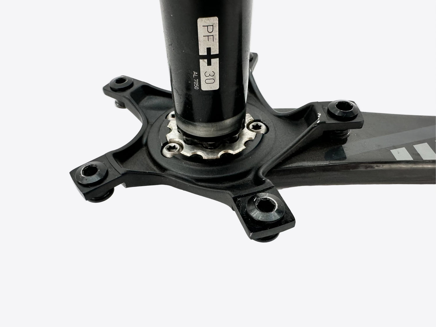 Close-up of a bicycle crankset on a white background