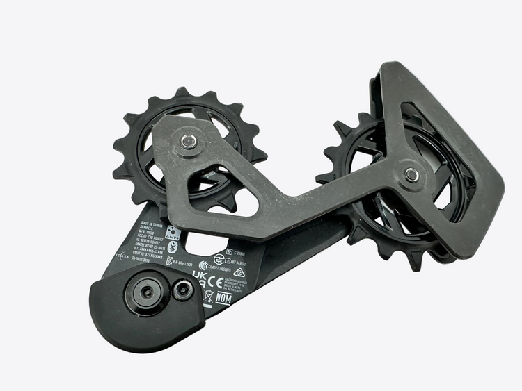 Black mechanical component with gears on a white background
