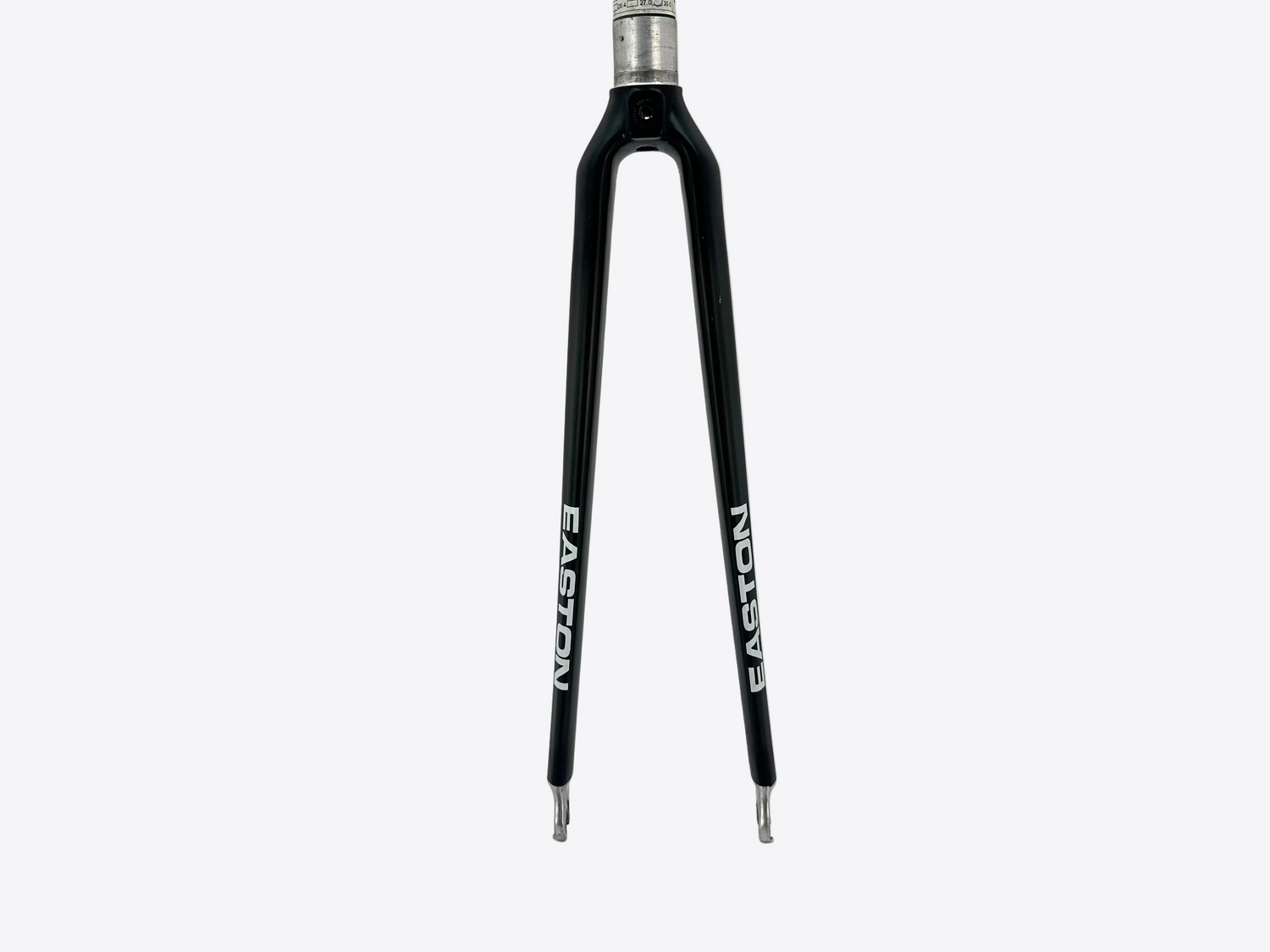 Black bicycle fork with white branding on a light gray background