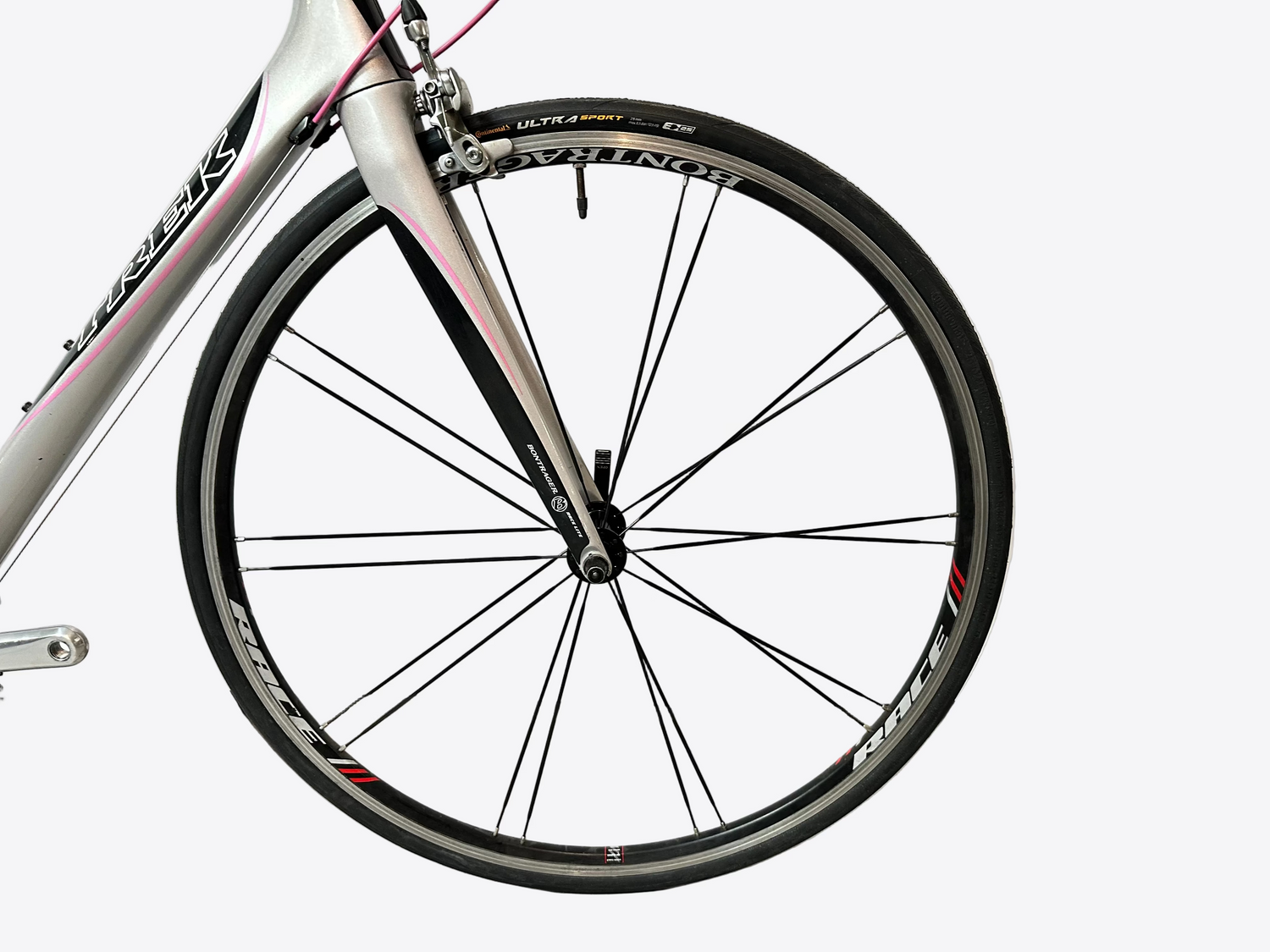 Close-up of a bicycle wheel with a white background