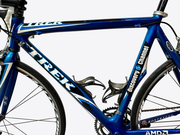 Blue Trek bicycle with visible branding on a white background