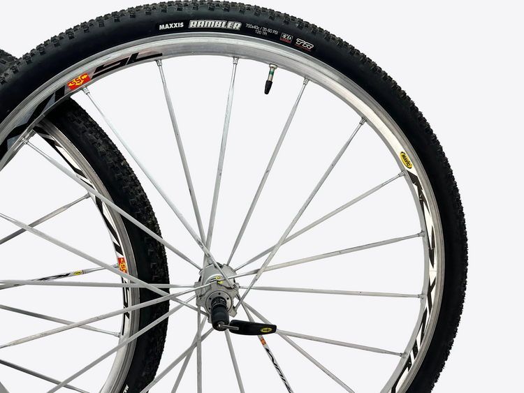 Close-up of a bicycle wheel with a white background